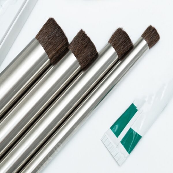 4 black steel pipes with pig bristles